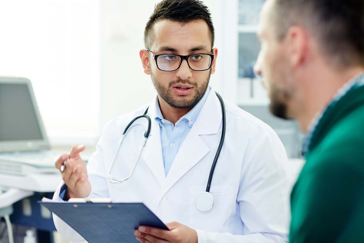 Man talking to Doctor.